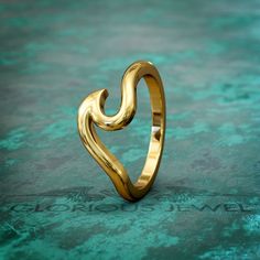 This stunning Gold Wave Ocean wedding band bridal ring is a true masterpiece that captures the essence of the sea. Crafted with intricate details resembling gentle waves dancing in the ocean, this unique ring symbolizes everlasting love and eternal commitment. The shimmering gold adds a touch of elegance and luxury, making it the perfect choice for your special day. Whether you're planning a beach or nautical-themed wedding, this exquisite ring will be a beautiful reminder of your love story. Ad Rosé Model, Nautical Wedding Theme, Ocean Wedding, Gold Waves, Bronze Jewelry, Bridal Bands, Unique Ring, Beach Inspired, Bridal Ring