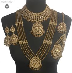 bridal jewellery set. Set includes- Necklace  Mala  Earrings  Jhumar  Tikka  1 Panjagla Nose ring Gold Chandbali Jewelry Sets For Wedding, Bollywood Style Gold Bridal Accessories With Hand Set Details, Hand Set Gold Bollywood Bridal Accessories, Gold Hand Set Bridal Accessories For Marriage, Gold Bridal Accessories With Intricate Design For Marriage, Gold Bridal Sets With Stone Work For Celebration, Gold Chandbali Bridal Accessories Hand Set, Gold Chandbali Hand Set Bridal Accessories, Bollywood Gold Bridal Accessories With Intricate Design