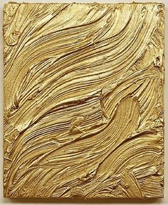 an abstract painting with gold paint on it