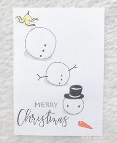 a christmas card with two snowmen on it