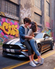 two people sitting on the hood of a car in front of graffiti covered wall and buildings