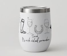 a white wine tumbler with some drawings on it