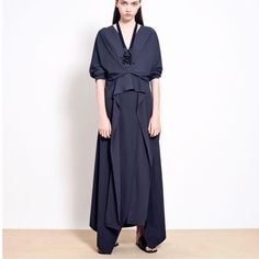 A Polished Maxi Style, This Dress Is Crafted From Fluid Crepe In A Relaxed Yet Elegant Silhouette. It Is Designed With The Illusion Of A Layered Wrap Front, And Has An Extended Sash Length That Hangs Down The Front, And Has An Extended Sash Length That Hangs Down The Front For A Fluid, Graphic Effect. The Dress Has Side Splits To Reveal A Peek Of Skin As You Move, And Ends In Asymmetrical Panels. A Slip-On Style, Wear It With Summer Sandals Or Evening Shoes For A Night Out. Maxi Dress Navy, Maxi Styles, Evening Shoes, Sandals Summer, Night Out, Slip On, Maxi Dress, Navy, Womens Dresses