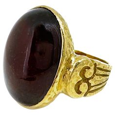 A big, natural dark oxblood red garnet cabochon is set in an original ring design by Eytan Brandes, featuring classical "columns" that reach up to the center mounting. Eytan hammered the surface throughout so that it catches dark and light reflections and looks great from every angle, and for an extra secret touch, the top of one of the columns is set with a small (0.02 carat) natural white diamond. The oval-shaped cabochon is an untreated hessonite garnet, dark reddish orange, with natural inte Secret Touch, The Ring Face, Les Angles, Oxblood Red, Hessonite Garnet, Reddish Orange, Light Reflection, Red Garnet, Solitaire Ring