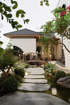 a house that is surrounded by plants and rocks in front of the entrance to it