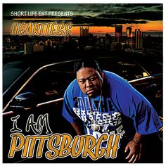 a man standing next to a car with the words i am pittsburgh in front of him