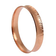 A slender bangle bracelet is a must-have for any woman's accessory collection, and the John S. Brana Chased Anticlastic Copper Bangle Bracelet is the perfect choice to complete your jewelry box or a special lady's. The styling possibilities for this chic handmade copper bangle are truly unlimited. Wear it on its own for a simple accent or purchase more than one and wear them together for a Boho beautiful layer effect. Mix and match the bangle with cuff, wrap and bangle bracelets to show off your Elegant Metal Band Bracelets, Elegant Metal Band Bracelet, Elegant Band Bracelets As Gifts, Elegant Band Bracelet For Gift, Formal Adjustable Stackable Bangle, Modern Band Bracelet As Gift, Modern Stackable Bangle As A Gift, Adjustable Band Bangle For Formal Occasions, Modern Band Bracelets For Gifts