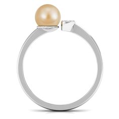 Product Details Make a statement with your simple yet noticeable style with the South Sea Pearl Open Cuff Solitaire Ring. This stunning engagement ring features a round pearl set on one end and Diamond accents on the other, creating a unique and eye-catching design. Crafted from solid gold, this pretty golden pearl ring is the perfect accessory for June-born women who want to showcase their elegance and sophistication. Product Information SKU SHP-RINGS082221297 Weight 2.40 gm (Approximate) SOUTH SEA PEARL INFORMATION No.of Stones 1 Pieces Total Weight 4.87 Carat (Approximate) Dimension(approx) Round-8X8 mm-1 Pcs Color Golden Cut Brilliant Shape Round Setting Type Bead-Set Quality Grade AAA DIAMOND INFORMATION No.of Stones 5 Pieces Total Weight 0.12 Carat (Approximate) Dimension(approx) Rou Golden Pearl, Stunning Engagement Ring, Sea Pearl, 18k Yellow Gold Ring, Pearl Set, South Sea Pearls, Sea Pearls, South Seas, Shop Engagement Rings