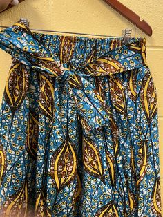 A fabulous multiple print skirt. It has a ribbed elastic waistband with ties on the side to help make a comfortable fit for multiple sizes. The full length skirt has deep pockets. This is a skirt that will not go out of style. The length is of the skirt is 36 inches.Don't delay order yours today. Skirt African Print, African Skirt, African Print Skirt, African Skirts, Skirt Wrap, Full Length Skirts, Skirt Skirt, Print Skirt, African Fabric