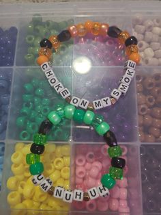 the beads are arranged in different colors and shapes to make bracelets for someone's special occasion