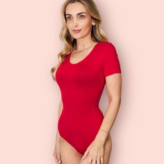 This product is equipped with a basic style that provides moderate stretch and is made with a blend of 95% rayon and 5% spandex, giving it an opaque and sheer look. For easy maintenance, simply machine wash on a cold setting and tumble dry on low heat. Product measurements: Small: Length 27.7 in, Shoulder 13.7 in, Bust 32.4 in, Waist 27.3 in, Sleeve Length 6.8 in, Hip 32.8 in Medium: Length 28.5 in, Shoulder 14.2 in, Bust 34.7 in, Waist 29.6 in, Sleeve Length 7 in, Hip 35.1 in Large: Length 29.3 in, Shoulder 14.5 in, Bust 37.1 in, Waist 32 in, Sleeve Length 7.2 in, Hip 37.4 in X-Large: Length 30.4 in, Shoulder 14.9 in, Bust 39.4 in, Waist 35.1 in, Sleeve Length 7.4 in, Hip 40.6 in 2XL: Length 31.4 in, Shoulder 15.9 in, Bust 43.3 in, Waist 39 in, Sleeve Length 7.6 in, Hip 44.5 in 3XL: Lengt Smoothing V-neck Bodysuit, Solid One-piece Smoothing Leotard, Smoothing One-piece Leotard, Fitted Solid Color Bodysuit With Scoop Neck, High Stretch Scoop Neck Bodysuit, Stretch Bodysuit With Scoop Neck In Solid Color, Stretch Scoop Neck Bodysuit In Solid Color, Scoop Neck Stretch Bodysuit In Solid Color, Seamless Solid Color One-piece Bodysuit