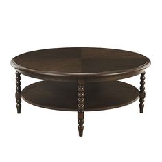 an oval coffee table with two tiered legs and a wooden top, in dark wood