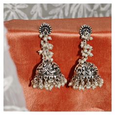 Stunning heavy look ethnic earrings  jhumka jhumki stud Afghani earrings in silver tone  With intricate carved work and sparkling ghunghroos which gives a traditional touch to the earrings  Perfect with ethnic and traditional wear  Can be a perfect gifting option for friends and dear ones  Silver metallic ghunghroo tinkle to create a striking look  With intricate carved word and sparkling ghunghroo which gives a traditional touch to the earring. Silver metallic base tinkle to create a striking l Silver Tilla Jhumkas For Festival, Handmade Silver Bohemian Jhumkas, Bohemian Sterling Silver Heavy Jhumkas, Bohemian Silver Handmade Jhumkas, Silver Bohemian Jhumkas For Wedding, Silver Bohemian Wedding Jhumkas, Sterling Silver Bohemian Jhumkas, Bohemian Sterling Silver Drop Jhumkas, Bohemian Sterling Silver Jhumkas With Intricate Design