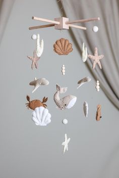 a mobile with sea animals and shells hanging from it