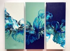 three abstract paintings on canvases with blue and green colors