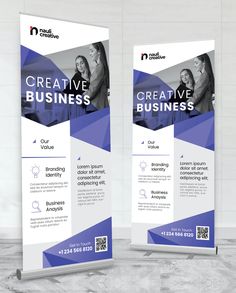 two roll up banners with blue and white shapes on the front, one is for creative business