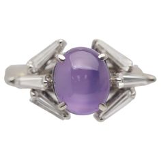 A chic and stylish geometric ring featuring a 3.87 carat star sapphire with a clean rich purple color. The sapphire has excellent clarity along with a strong 6-rayed star making the stone a true gem. It is complemented by 6 baguette-cut diamonds which are set around the sapphire in a unique geometric pattern and weigh a total of 0.57 carats. Hand-fabricated in platinum and ready to be worn. Ring Size 6.25 Weight: 9.2 grams Star Making, Diamond Platinum Ring, Star Sapphire Ring, Purple Star, Platinum Diamond Rings, Pink Star, Rich Purple, Star Sapphire, Geometric Ring