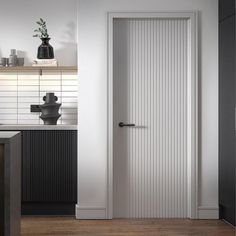 a white door in a kitchen next to a counter