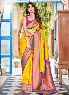 Upgrade your saree game with the HaldiWear Yellow Zari And Thread Woven Soft Paithani Silk Saree. The vibrant color and intricate weaving add a touch of elegance to your wardrobe. Comes with a contrasting blouse for added style options. Perfect for rocking at weddings and special occasions! The unstitched blouse can be customized unto 44 inches. Do Note: All the accessories shown are for styling purpose only. Slight color variation may occur due to photographic reasons. Fall and Pico : Done Drap Silk Saree With Contrast Blouse, Drapping Saree, Saree With Contrast Blouse, Paithani Silk Saree, Peach Saree, Lace Saree, Purple Saree, Orange Saree, Indian Designer Sarees