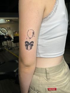 a woman with a small tattoo on her arm