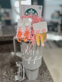 a starbucks cup filled with lots of different items