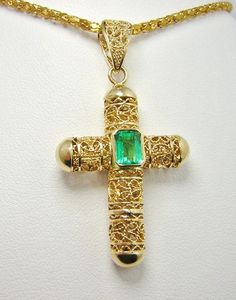 "Colombian Emerald Filigree Cross Pendant 1 Natural Emerald Square Cut Emerald / Size ~ .85 Carats Color ~ Medium-Green / Clarity ~ Type 3 Metal Purity ~ 18K Yellow Gold / Weight ~ 6.04 Grams Beautiful Holy Cross ~ Brilliant Emerald MEASUREMENTS North to South including Bail ~ 43.24 mm (1.7036 Inches) East to West at Widest Section ~ 23.75 mm (0.9357 Inches) East to West (Bail Section) ~ 5.80 mm (0.2285 Inches) Fits a Chain or Necklace 6.00 mm (0.2364 Inches Estimated Retail Replacement Value $5 Emerald Cross, Emerald Pendant, Colombian Emeralds, Cross Jewelry, Gold Cross, Square Cut, Fine Jewellery Necklace, Natural Emerald, Square Shape