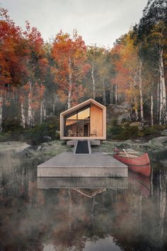 a boat sits on the water in front of a cabin