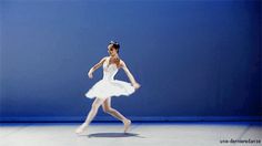 a ballerina in white tutu and ballet shoes