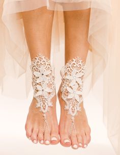 One of a kind, Zaria Barefoot Sandals are unique lace barefoot sandals that will look absolutely ravishing on your wedding day at the beach. These absolutely gorgeous foot jewels are carefully handmade using white French lace, white ribbons, white plated chain, and some flower applique to extenuate your gorgeous pedi. When wearing Zaria Sandals you will truly feel like a princess. The intricate detail of the lace design looks stunning on, and can be worn in the pool or in the water. Feel 100% co Gold Barefoot Sandals, Lace Barefoot Sandals, Lace Bridal Shoes, Barefoot Sandals Wedding, Beach Wedding Sandals, Point Pleasant Beach, Beach Wedding Shoes, Crochet Barefoot Sandals, Barefoot Sandal