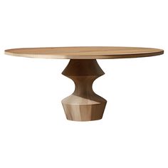 an oval wooden table with a circular base and wood grained finish on the top