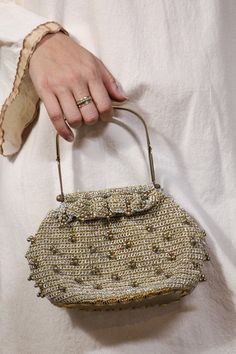 "Adorable beaded crochet handbag, has bronze metal structured straps. Clear bottom. Very cute and perfect for a glimmering night out. 9\" wide 5\" long" Elegant Crochet Bag With Gold-tone Hardware, Elegant Beaded Crochet Bag, Chic Gold Crochet Evening Bag, Vintage Embellished Bag As Fashion Accessory, Vintage Embellished Bag, Elegant Everyday Beaded Crochet Bag, Gold Beaded Clutch For Everyday Use, Gold Evening Bag With Handles, Glamorous Gold Beaded Shoulder Bag