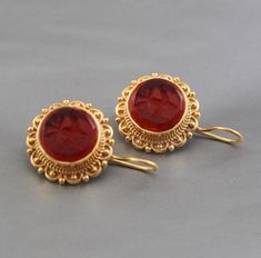 ✽ D E T A I L S   {Gemstone} - Red Glass   {Gemstone Size} - 15 mm   {Earring Height Including Hoop} - 3 cm   {Earring Width} - 2  cm   {Finish} - Smooth and high polished with Little Oxide Antique Look.   {Note} -Production time is about 3-5 working days. The one you receive may be slight different from the one                  in the picture due to handmade nature, but it will be almost same as in the above picture.    These pieces are handcrafted from start to finish and have an imperfect han Byzantine Cabochon Jewelry For Gifts, Byzantine Jewelry With Cabochon For Gifts, Byzantine Style Cabochon Jewelry For Gifts, Byzantine Style Cabochon Jewelry Gift, Classic Red Cabochon Earrings, Round Cabochon Earrings As Gift, Handmade Byzantine Round Earrings, Classic Cabochon Earrings For Gift, Byzantine Gemstone Earrings Gift