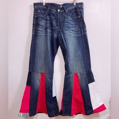 a pair of blue jeans with red and white trims