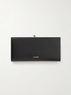 Jil Sander's accessories echo the minimalist design codes of its runway collections. This medium wallet has been made in Italy from smooth leather with a sleek gold-tone frame and matching clasp. It has 12 card slots and a separate compartment for coins. Jil Sanders, Runway Collection, Jil Sander, Sanders, Smooth Leather, Women Collection, Leather Wallet, Minimalist Design, Card Slots