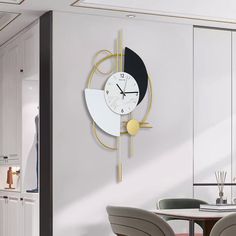 a clock that is on the side of a wall in a room with chairs and tables