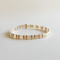 Dainty White Stretch Bracelet For Everyday, White Dainty Stackable Stretch Bracelet, Dainty White Stackable Stretch Bracelet, Dainty White Stretch Bracelet As Gift, Adjustable Flexible Stretch Bracelet For Everyday, Adjustable White Dainty Stretch Bracelet, White Adjustable Dainty Stretch Bracelet, Dainty White Adjustable Stretch Bracelet, Adjustable White Stackable Stretch Bracelet