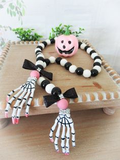 a wooden table topped with halloween decorations on top of it's legs and hands