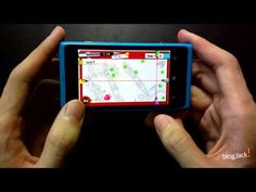 a person holding a cell phone in their hands with a gps app on the screen