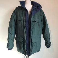 Eddie Bauer Vintage Goose Down Ridge Line Gore-Tex Winter Jacket 30742, Size Men’s Medium. Excellent Preowned Condition. No Rips, Tears Or Stains. Unisex See Measurements. Color: Evergreen Green / Navy Blue Interior. Material 100% Nylon & Goose Down With Gore-Tex Lamination. A Puffer Interior, Parka Exterior. Detachable Hood. Armpit To Armpit Inside: 26”; Shoulder To Hem 29.75”; Sleeve Armpit To End 21”. Smoke Free. 348 Eddie Bauer Womens Winter Coat, Green Fleece-lined Outerwear For Outdoor, Green Nylon Hooded Jacket With Double-lined Hood, Eddie Bauer K-6 Boots, Gore Tex Jacket, Blue Interior, Detachable Hood, Eddie Bauer, Gore Tex