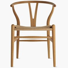 the wish chair is made from solid wood and has an upholstered seat with a woven