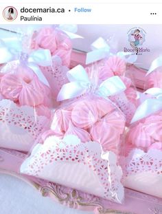 pink and white candy bags with bows on them