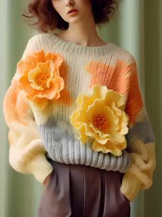 a woman with flowers on her sweater