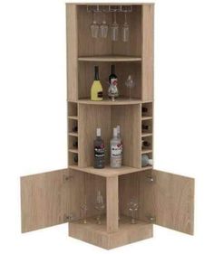 an open cabinet with bottles and glasses in it