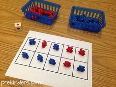 two plastic bins filled with red, white and blue beads next to a game