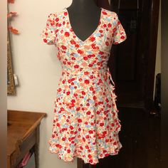 New Without Tags. Never Worn/No Known Flaws. Truly A Lovely Dress. It’s Soft To The Touch (And Comfortable!). The Fit, Material, And Design Make For A Very Flattering, Slimming Fit. Has Stretch To It. Cute Detail On Top Of The Sleeves (Pictured). All-Over Flower Print. Strings On The Side To Tie Anyway You Please. Can Easily Be Dressed Up Or Down. Not Quite “Mini,” But Def More Mini Than Midi. 100% Polyester. Size Small But, Depending On How You Like The Fit, It Can Definitely Fit A Size Medium Fitted Multicolor Mini Dress With Tie Back, Casual Fitted Dress With Tie Back, Fitted Summer Mini Dress With Tie Waist, Fitted Multicolor Dress With Ruffle Hem, Red Fitted Dress With Tie Waist, Fitted Red Dress With Tie Waist, Fitted Mini Dress With Tie Waist And Short Sleeves, Fitted Mini Dress With Tie Waist For Spring, Red Tie Waist Dress For Spring