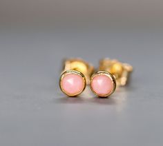 Rose Cut Pink Opal stud earrings, October birthstone gift for Love and Abundance. Subtle Wedding Earrings. Valentine's Day Gift. Every piece of jewellery tells a story, especially the jewellery you choose to celebrate the special events of your life. Treasured moments of wedding days, anniversaries and birthdays can be remembered in a beautiful piece of handmade, bespoke jewellery. This precious Pink Opal sparkles from the centre of a delicate 14k gold filled bezel cup stud setting. These natura Dainty Pink Earrings For Anniversary, Delicate Birthstone Earrings For Wedding, Pink Wedding Earrings With Birthstone, Elegant Pink Opal Jewelry With Natural Stones, Dainty Pink Opal Gemstone Jewelry, Adjustable Gold Pink Opal Jewelry, Pink Opal Drop Earrings, Opal Earrings Stud Rose Gold, Opal Stud Earrings