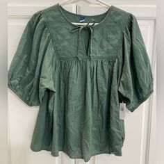 Nwt Super-Cute, Green Blouse With Quilted Neckline. Perfect Color For Fall! Casual Blouse With Puff Tie Sleeves, Green Tie Neck Top For Fall, Puff Sleeve Tops With Tie Sleeves For Daywear, Puff Sleeve Tops With Tie Sleeves For Brunch, Cotton Blouse With Tie Sleeves For Daywear, Casual Tops With Tie And Puff Sleeves, Cotton Blouse With Tie Sleeves And Puff Sleeve, Fall Cotton Tie Neck Blouse, Green Short Sleeve Blouse For Brunch