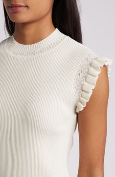 Ruffled cuffs and lacy stitching sweeten the vibe of this cap-sleeve sweater knit with dense, stretchy ribbing that gives it its figure-skimming fit. Mock neck Cap sleeves 63% viscose, 37% nylon Hand wash, dry flat Imported White Ruffled Knit Top For Spring, Feminine White Knit Top, Chic Knit Sweater With Ribbed Cuffs, Elegant Fitted Sweater With Lace Trim, Elegant Ruffled Knit Tops, Elegant Knit Tops With Ruffles, Feminine Fitted Textured Knit Top, Feminine Fitted Pointelle Knit Top, Fitted Feminine Pointelle Knit Sweater