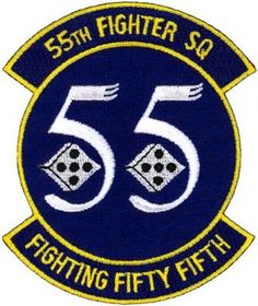 the 55th fighter squadron patch is shown in blue and yellow with white lettering on it