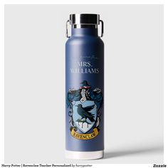 a harry potter water bottle with the hogwarts crest on it's side